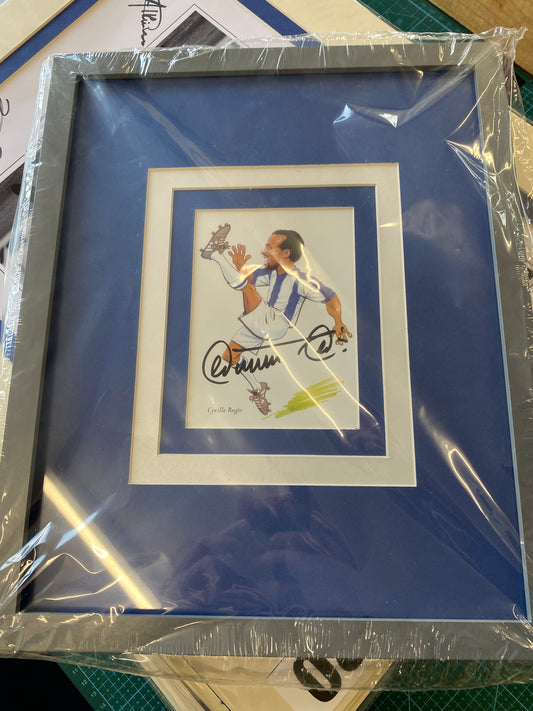 West Bromwich Albion Cyrille Regis framed caricature personally signed.